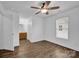 Spacious bedroom with ensuite bathroom, wood flooring, and neutral paint at 126 Newsome Rd, Salisbury, NC 28146