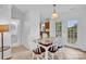 Cozy dining area with access to a bathroom, backyard, and open view of the kitchen at 126 Newsome Rd, Salisbury, NC 28146