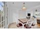 Inviting dining area with lots of natural light, a modern light fixture, and a table that seats six at 126 Newsome Rd, Salisbury, NC 28146