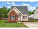 Charming home featuring a brick facade, complemented by a well-manicured lawn and inviting front entrance at 126 Newsome Rd, Salisbury, NC 28146