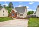 Attractive home featuring a brick and siding design, a well-kept lawn, and a paved driveway at 126 Newsome Rd, Salisbury, NC 28146