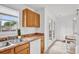 Bright kitchen showcasing wooden cabinets, modern appliances, and a view to the backyard at 126 Newsome Rd, Salisbury, NC 28146