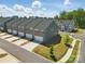 Aerial view of newly constructed townhomes, showcasing the architecture, driveways, and landscaping at 134 Berkeley Ave, Mooresville, NC 28117