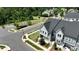 An aerial perspective of townhomes situated near a park with walking paths and green spaces at 134 Berkeley Ave, Mooresville, NC 28117