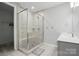 Beautiful bathroom featuring a glass enclosed shower with seating, tiled walls, and modern fixtures at 134 Berkeley Ave, Mooresville, NC 28117