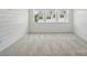 Bedroom with carpet, shiplap wall accent, and ample natural light at 134 Berkeley Ave, Mooresville, NC 28117