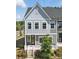 Charming two-story home with white trim, gray siding, and beautiful landscaping at 134 Berkeley Ave, Mooresville, NC 28117