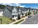 Up close exterior view of new townhomes showcasing modern design, landscaping, and inviting entryways at 134 Berkeley Ave, Mooresville, NC 28117
