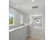 Upstairs hallway with carpet, neutral paint, and ample natural light at 134 Berkeley Ave, Mooresville, NC 28117