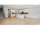 Modern kitchen features white cabinets, stainless steel appliances, a tile backsplash, and a large island at 134 Berkeley Ave, Mooresville, NC 28117