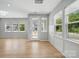 Airy living area showcases hardwood floors and large windows offering views of the neighborhood at 134 Berkeley Ave, Mooresville, NC 28117