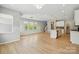 Open concept living room with modern hardwood floors, recessed lighting, and a kitchen island at 134 Berkeley Ave, Mooresville, NC 28117