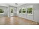 Bright living room boasts hardwood floors, neutral walls, and large windows, for natural light at 134 Berkeley Ave, Mooresville, NC 28117