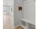 Bright mudroom features a built-in bench with storage and coat hooks at 134 Berkeley Ave, Mooresville, NC 28117