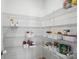 Walk-in pantry with metal shelving and organized storage baskets at 134 Berkeley Ave, Mooresville, NC 28117