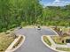 Well-maintained parking lot surrounded by landscaped greenery and lush trees, offering convenient parking at 134 Berkeley Ave, Mooresville, NC 28117