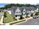 Street view of modern townhomes, accentuating the landscaped front yards and the architectural style at 134 Berkeley Ave, Mooresville, NC 28117