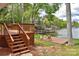 Wooden deck steps leading to the water offering a tranquil place to relax and enjoy the lake view at 139 Sanford Ln, Badin Lake, NC 28127