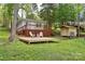 Inviting backyard featuring a deck with seating and a shed at 139 Sanford Ln, Badin Lake, NC 28127