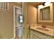 This bathroom features a vanity and a view through the doorway into another room at 139 Sanford Ln, Badin Lake, NC 28127