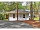 Exterior view of home with lake access, showing siding, windows, and steps to the water at 139 Sanford Ln, Badin Lake, NC 28127