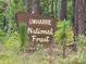 Uwharrie National Forest sign surrounded by verdant trees at 139 Sanford Ln, Badin Lake, NC 28127