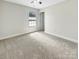 Bedroom with neutral walls, plush carpet, window, and a ceiling fan at 1399 Foxbrook Cir, Lancaster, SC 29720