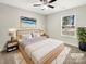 Serene main bedroom featuring a plush bed, soft lighting, and a leafy green plant at 1399 Foxbrook Cir, Lancaster, SC 29720