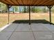 Covered patio with a view of the backyard and surrounding trees at 1399 Foxbrook Cir, Lancaster, SC 29720