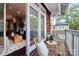 Charming balcony with wicker chairs overlooking neighborhood, adjacent to stylish interior space at 1412 W 4Th St, Charlotte, NC 28208