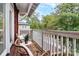 Cozy balcony with wicker seating, offering a serene outdoor space and neighborhood views at 1412 W 4Th St, Charlotte, NC 28208