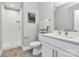 Modern bathroom with a walk-in shower and sleek, white vanity at 1412 W 4Th St, Charlotte, NC 28208