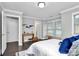Cozy bedroom with desk, chair, and ample natural light from large windows at 1412 W 4Th St, Charlotte, NC 28208