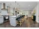 Modern kitchen with stainless steel appliances, gray cabinets, pendant lighting, and large island with bar seating at 1412 W 4Th St, Charlotte, NC 28208