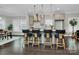 Open-concept kitchen featuring bar seating, pendant lighting, and modern appliances at 1412 W 4Th St, Charlotte, NC 28208