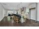 Open-concept kitchen island with bar seating and access to the dining area at 1412 W 4Th St, Charlotte, NC 28208