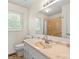 Well-lit bathroom featuring a vanity and a shower with a curtain at 1504 Andicot Ln, Shelby, NC 28152