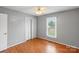 Spacious bedroom featuring hardwood floors, a ceiling fan, and a sun-filled window at 1504 Andicot Ln, Shelby, NC 28152