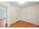Neutral bedroom featuring hardwood floors and closet space at 1504 Andicot Ln, Shelby, NC 28152