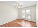 Standard bedroom with hardwood floor, window, and ceiling fan with lights at 1504 Andicot Ln, Shelby, NC 28152