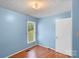 Bedroom featuring hardwood floors and a large window at 1504 Andicot Ln, Shelby, NC 28152