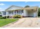 Charming single-story home with a welcoming porch and a convenient attached carport at 1504 Andicot Ln, Shelby, NC 28152
