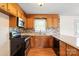 The well-equipped kitchen features stainless steel appliances and lovely wood cabinetry at 1504 Andicot Ln, Shelby, NC 28152