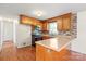 Well-lit kitchen with stainless steel appliances, wood cabinets, and mosaic backsplash at 1504 Andicot Ln, Shelby, NC 28152