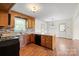 Charming kitchen with wood cabinets, stainless appliances, and a connecting dining area at 1504 Andicot Ln, Shelby, NC 28152