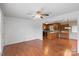 Open-concept living space boasts hardwood floors, a ceiling fan, and a seamless transition to the kitchen at 1504 Andicot Ln, Shelby, NC 28152