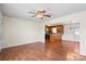 Inviting living area featuring hardwood floors and a view into the cozy kitchen at 1504 Andicot Ln, Shelby, NC 28152