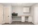 This finished basement offers versatile workspace with a built-in desk and additional storage cabinets at 1565 Oakridge Dr, Salisbury, NC 28146