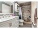 Beautifully renovated bathroom showcasing a walk-in shower with decorative stone floors and updated fixtures at 1565 Oakridge Dr, Salisbury, NC 28146