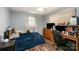 This bedroom features neutral paint, wood-look floors, and ample lighting, offering a comfortable atmosphere at 1565 Oakridge Dr, Salisbury, NC 28146